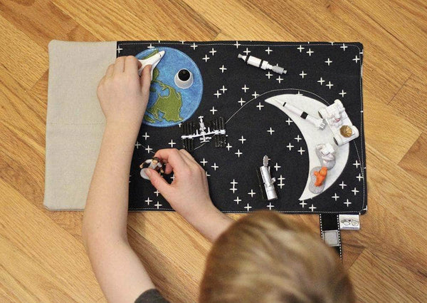 Pretend Play Sets - space toys for boys who love to travel. Overhead picture of boy playing with galaxy toys - Mouse Loves Pig